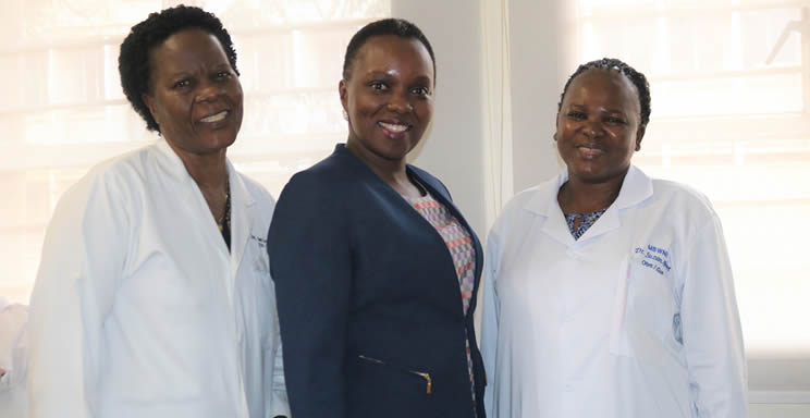 Dr. Susan Atuhairwe (center) with her fellow PhDs